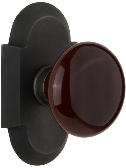 Arched Rosette Door Set with Brown Porcelain Knobs in Oil-Rubbed Bronze.